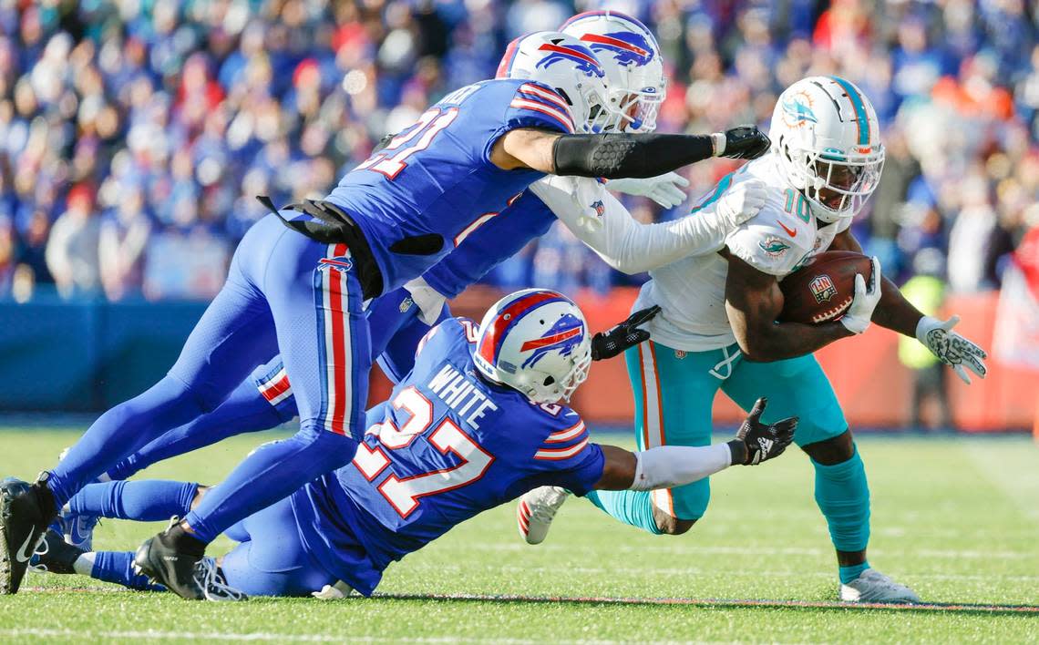 Miami Dolphins wide receiver Tyreek Hill (10) on a pass reception in the second quarter against the Buffalo Bills during the NFL wild-card football game at Highmark Stadium, Orchard Park, NY, on Sunday, January 15, 2023.