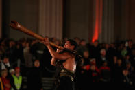 A Maori warrior signals the arrival of veterans, dignitaries and members of the public to the Cenotaph at the Auckland War Memorial Museum during the ANZAC Day Dawn Service on April 25, 2012 in Auckland, New Zealand. Veterans, dignitaries and members of the public today marked ANZAC (Australia New Zealand Army Corps) Day, when First World War troops landed on the Gallipoli Peninsula, Turkey early April 25, 1915, commemorating the event with ceremonies of remembrance for those who fought and died in all wars. (Photo by Phil Walter/Getty Images)