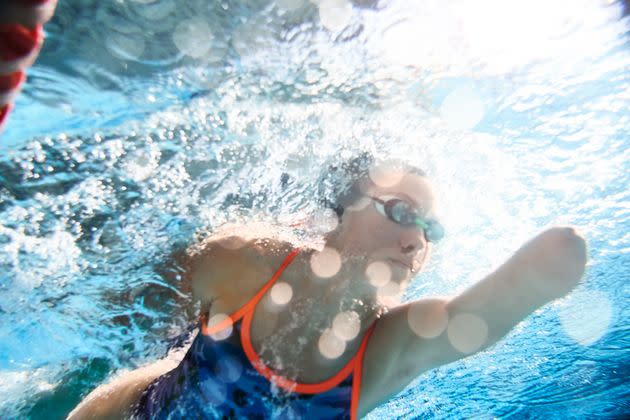 Low-impact cardio workouts, like swimming, can help as you recover from a back injury. (Photo: Tempura via Getty Images)