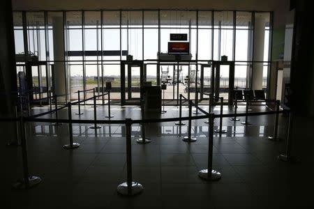 A closed departure gate is seen at the airport in Lodz October 10, 2014. REUTERS/Kacper Pempel