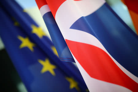 FILE PHOTO: European Union and British flags flutter in front of the chancellery ahead of a visit of British Prime Minister Theresa May in Berlin, Germany, April 9, 2019. REUTERS/Hannibal Hanschke