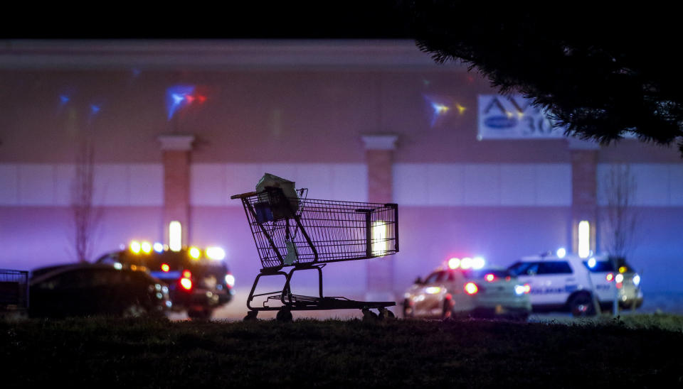 <p>A lone shopping cart sits in the parking lot as police investigate the scene of a shooting at a Wal Mart store in the Thorton Town Center shopping plaza on Nov. 1, 2017 in Thornton, Colo. (Photo: Marc Piscotty/Getty Images) </p>
