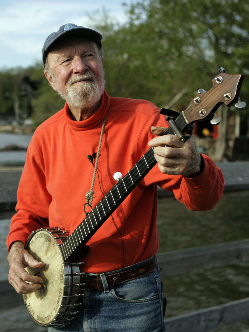 FILE - In this May 5, 2006 file photo, folk singer Pete Seeger plays his banjo in Beacon, N.Y. As what would have been his 95th birthday approaches, some wonder what would be a fitting tribute to the life of the singer/activist who was known for shunning personal accolades. (AP Photo/Frank Franklin II, File)