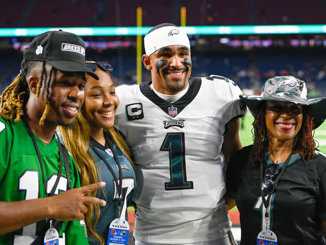 <p>Ken Murray/Icon Sportswire/Getty</p> Jalen Hurts with his brother, sister, and mother, before the football game between the Philadelphia Eagles and Houston Texans at NRG Stadium on November 3, 2022.