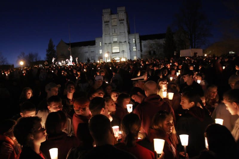 Virginia Tech students attend a candlelight vigil in front of Burress Hall for the 33 people who died the day before in two shooting incidents on campus in Blacksburg, Va., April 17, 2007. File Photo by Saul Loeb/UPI