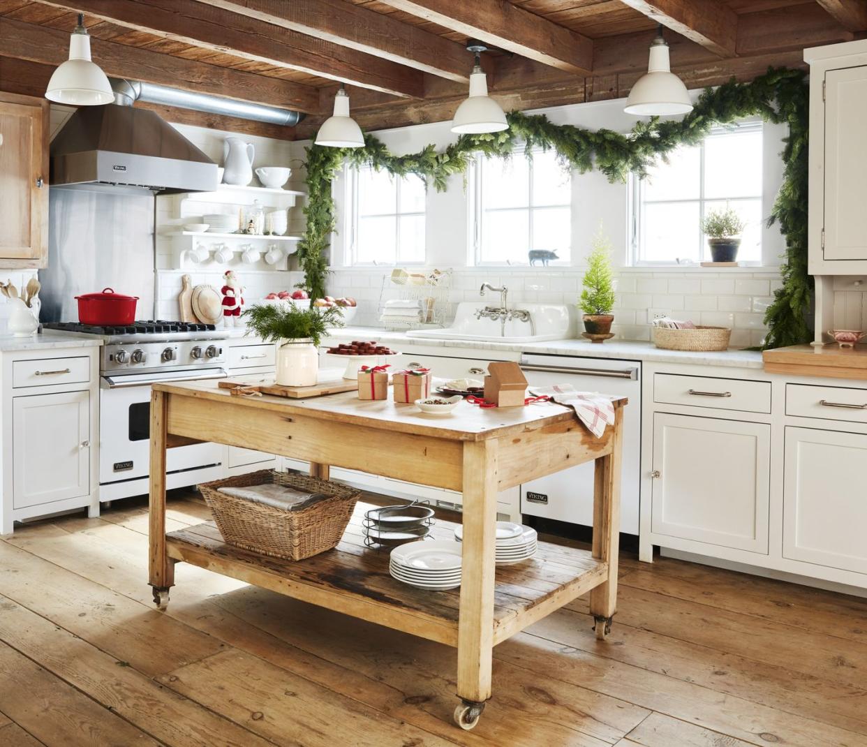 kitchen decorated for christmas with a rolling island