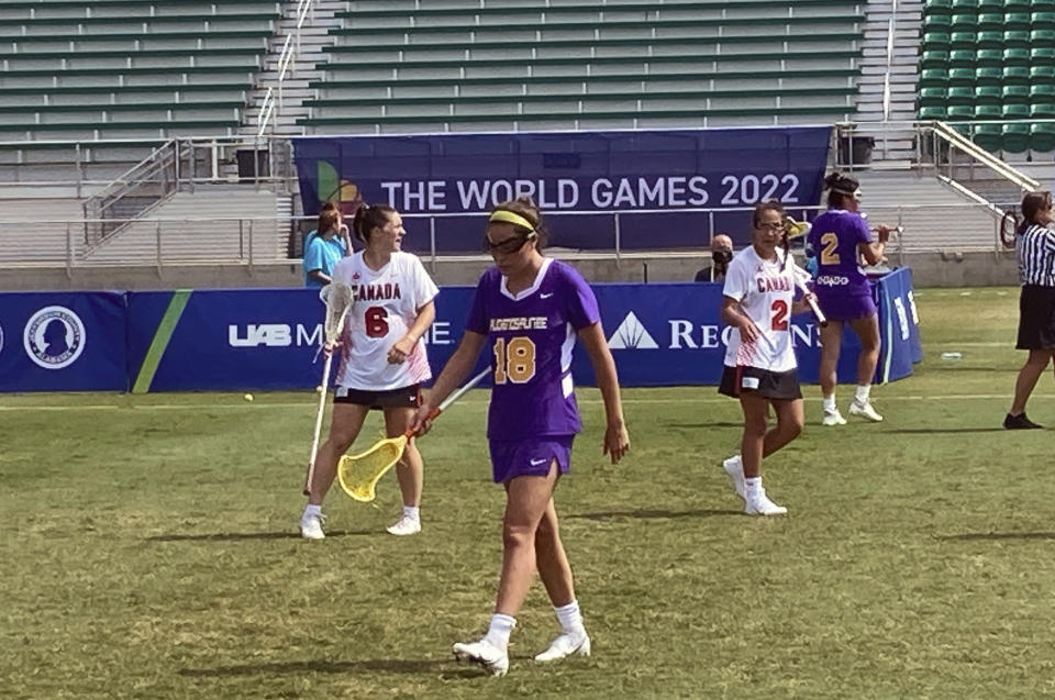 Lois Garlow of the Haudenosaunee Nationals lacrosse team heads toward the sideline during a match against Canada at the World Games in Birmingham, Ala., July 24, 2022. Members of the Haudenosaunee are hopeful they will have a chance to play the sport their people invented when lacrosse returns to the Olympics in 2028 in Los Angeles. (AP Photo/Paul Newberry)
