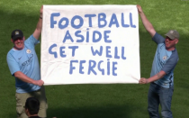 <p>Manchester City fans held up a batter to support Sir Alex Ferguson in the wake of the legendary Manchester United manager’s emergency surgery on Saturday. (Getty) </p>