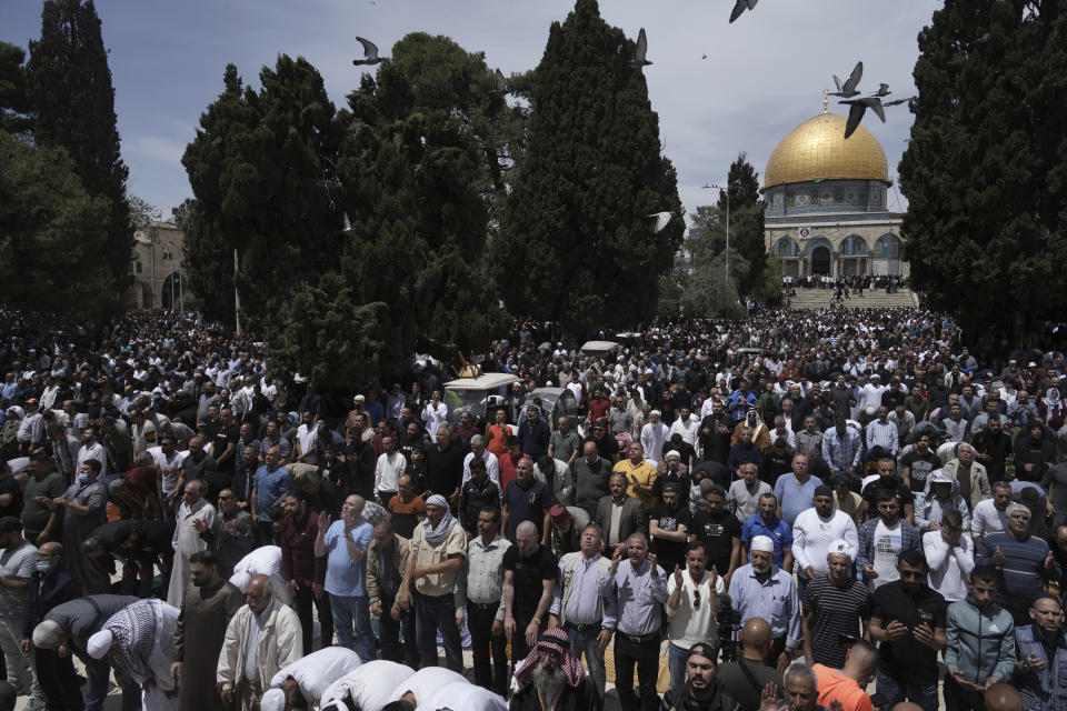 Palestinians gather for Friday prayers during the Muslim holy month of Ramadan, hours after Israeli police clashed with protesters at the Al Aqsa Mosque compound, in Jerusalem's Old City, Friday, April 22, 2022. (AP Photo/Mahmoud Illean)