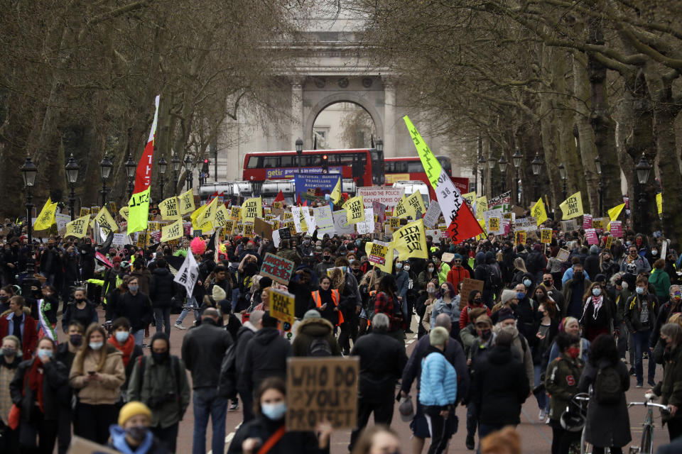 Demonstrators hold banners and flags during a 'Kill the Bill' protest in London, Saturday, April 3, 2021. The demonstration is against the contentious Police, Crime, Sentencing and Courts Bill, which is currently going through Parliament and would give police stronger powers to restrict protests. (AP Photo/Matt Dunham)