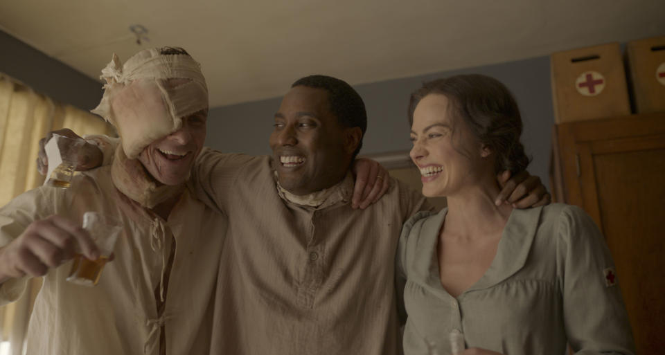 (L-R): Christian Bale, John David Washington, and Margot Robbie in 20th Century Studios' AMSTERDAM. Photo courtesy of 20th Century Studios. All Rights Reserved.