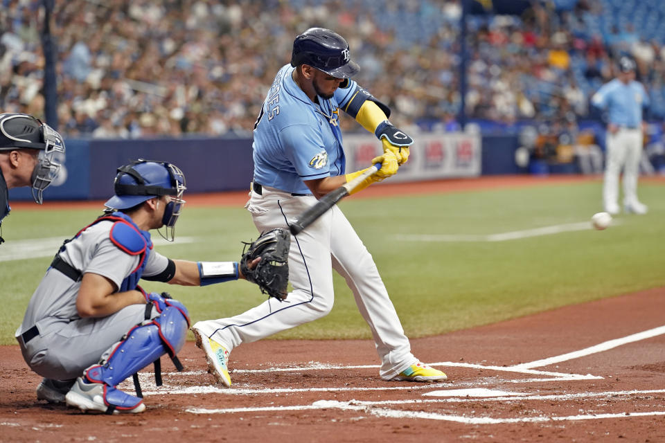 Tampa Bay Rays' Isaac Paredes connects for an RBI single off Los Angeles Dodgers starting pitcher Gavin Stone during the first inning of a baseball game Sunday, May 28, 2023, in St. Petersburg, Fla. Rays' Wander Franco scored on the hit. (AP Photo/Chris O'Meara)