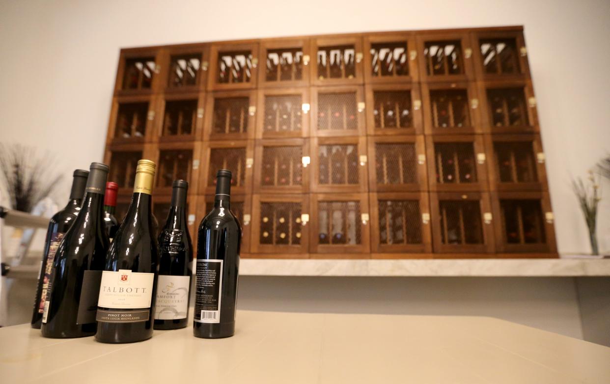 Several bottles of wine sit in front of the wine lockers in the future site of a wine lounge Monday, March 11, 2024, at the L Wine Bar at 530 E. Lexington Ave. in Elkhart. The site formerly was the 530 Wine Bar.