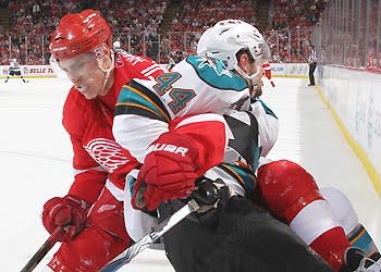 Valtteri Filppula and the Red Wings are headed in one direction while Marc-Edouard Vlasic and the Sharks appear heading opposite