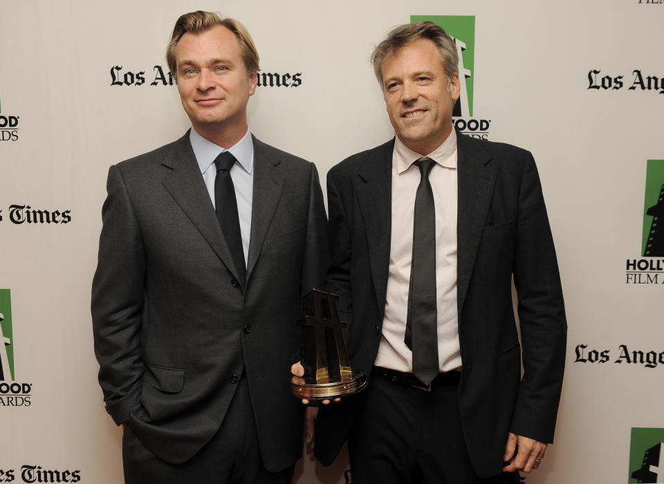 Wally Pfister, right, recipient of the Hollywood Cinematographer Award for the film "The Dark Knight Rises," poses with the film's director Christopher Nolan backstage at the 16th Annual Hollywood Film Awards Gala on Monday, Oct. 22, 2012, in Beverly Hills, Calif. (Photo by Chris Pizzello/Invision/AP)