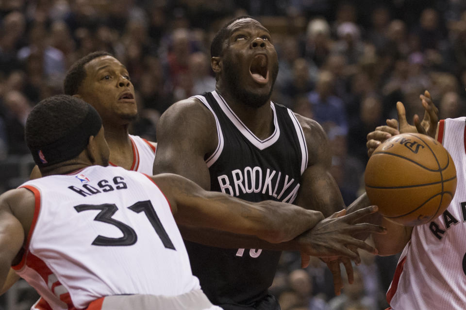 TORONTO, ON - DECEMBER 20: Toronto Raptors forward Terrence Ross (31) hammers Brooklyn Nets forward Anthony Bennett (13) and gets the foul. Toronto Raptors vs Brooklyn Nets in 1st half action of NBA regular season play at Air Canada Centre. Toronto Star/Rick Madonik        (Rick Madonik/Toronto Star via Getty Images)