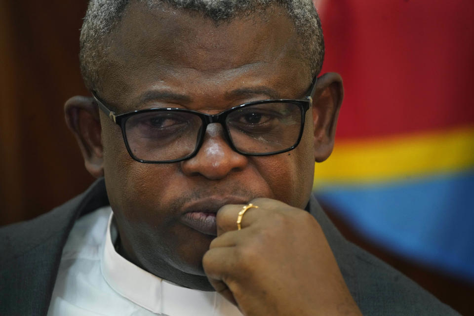 Father Donatien Nshole, general secretary of the Congolese Episcopalian National Conference (CENCO), speaks at a briefing in Kinshasa, Thursday Jan. 10, 2019. Congo's Catholic church says official presidential election results do not agree with the outcome that its 40,000 observers compiled in recording the results posted at all polling stations. (AP Photo/Jerome Delay)