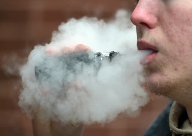 Stock photo of a man vaping