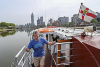 Danny Collier stands on deck aboard his boat, the Princess Freda on the river Thames in London, Friday, May 8, 2020. Danny and his brother John Collier are the proud owners of the boats the Princess Freda, the Queen Elizabeth, the Connaught and the Clifton Castle. All four boats have had their moment in the sun. And all four were meant to have another on Friday as Britain celebrates the 75-year anniversary of Victory in Europe Day. Instead, they're lying idle on the banks of the River Thames, not far from Kew Gardens in southwest London, as the festivities surrounding VE Day have been all but cancelled as a result of the coronavirus pandemic. For the brothers it’s nothing less than a disaster, one that could spell the demise of the company their late father created in 1975. (AP Photo/ Vudi Xhymshiti)