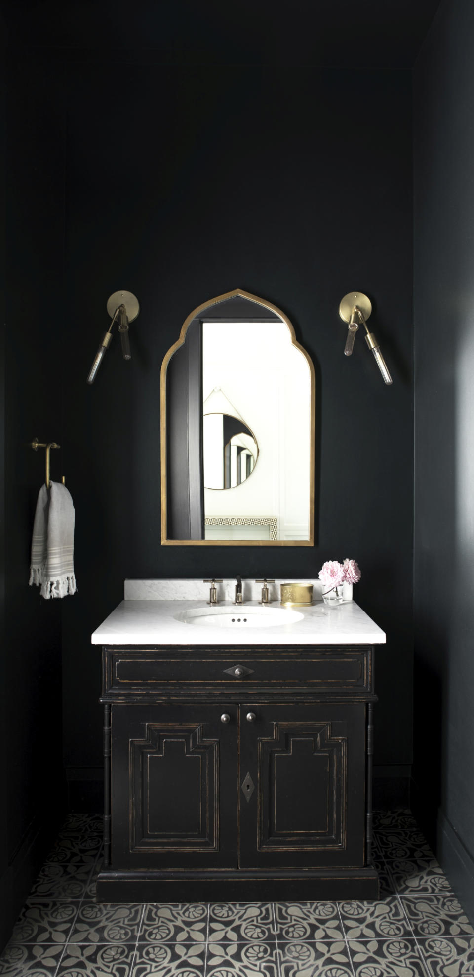 black powder room dark with metallic accents by Benjamin Moore