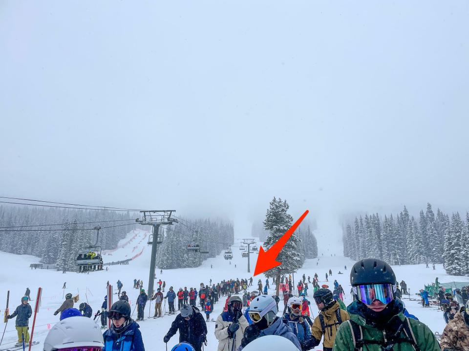 An arrow points to the end of a lift line on Copper Mountain in Colorado.