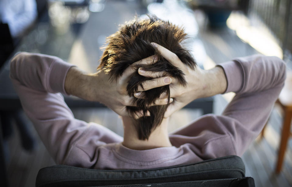 Sam Ware runs his fingers through his hair while listening to his mother urge him to go to rehab, in Fountaindale, Central Coast, Australia, Friday, July 19, 2019. Sam's life became an endless pursuit of pills. He sat anxiously in waiting room after waiting room, hoping each time the doctor would just give him the medicine without a fuss. He would ask himself what he was doing there, what kind of a life this was. The answers weren't enough to make him stop. (AP Photo/David Goldman)