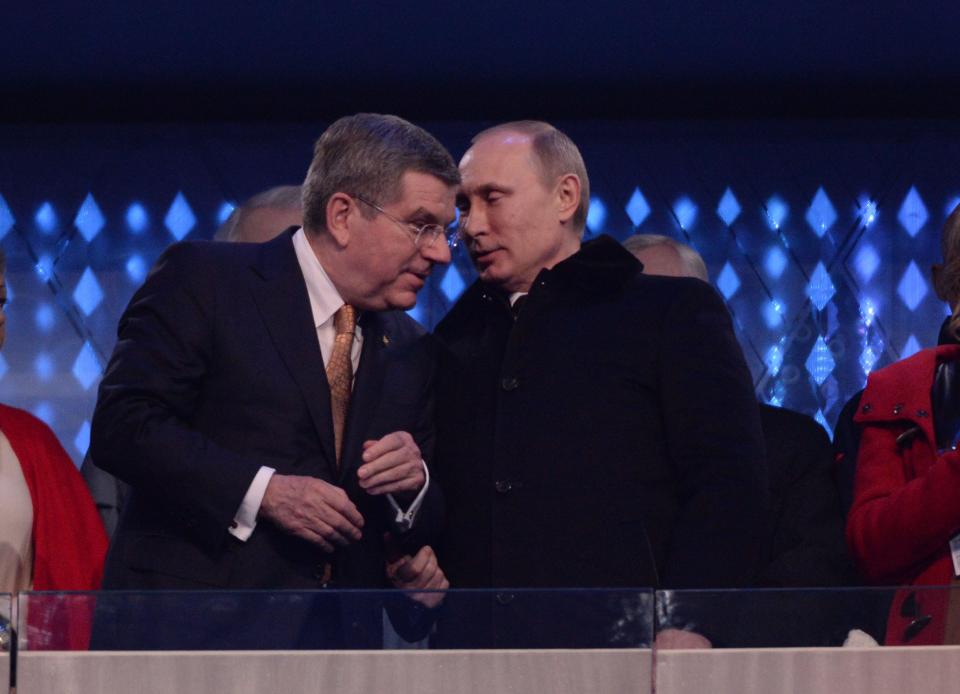 International Olympic Committee President Thomas Bach and Russian President Vladimir Putin during the opening ceremony for the Sochi 2014 Olympic Winter Games.