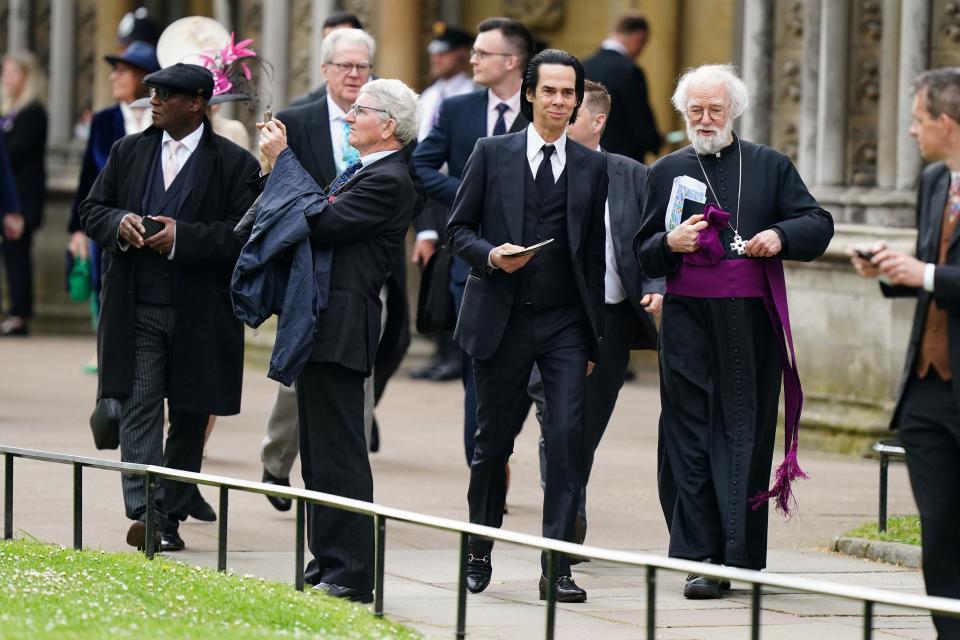 Nick Cave (centre) and former Archbishop of Canterbury Rowan Williams at coronation