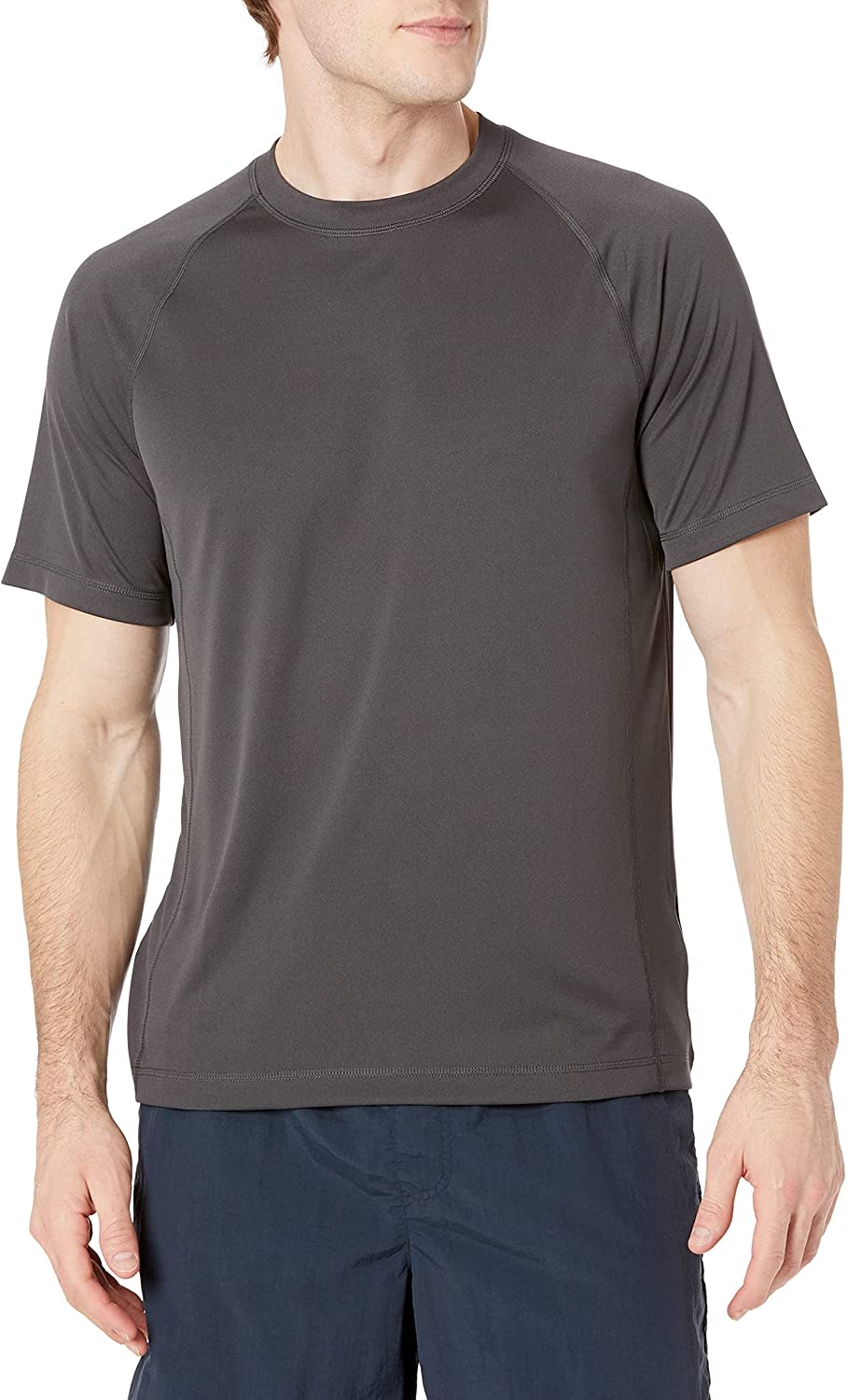 Man wears Amazon Essentials Men's Short-Sleeve Swim Shirt; best swim shirts