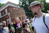 <p>Counter-protesters line the route taken by white nationalists, neo-Nazis and members of the ‘alt-right’ during the ‘Unite the Right’ rally August 12, 2017 in Charlottesville, Virginia. After clashes with anti-fascist protesters and police the rally was declared an unlawful gathering and people were forced out of Lee Park, where a statue of Confederate General Robert E. Lee is slated to be removed. (Photo: Chip Somodevilla/Getty Images) </p>