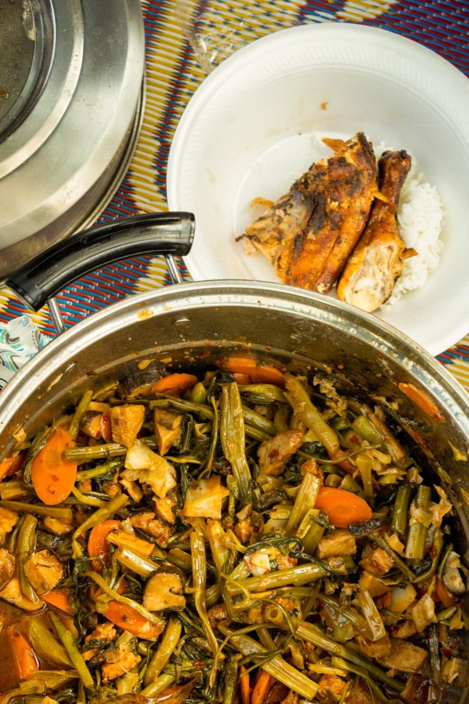 An overhead shot of a chicken and vegetable dish in a pot