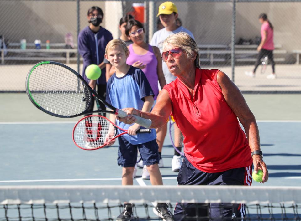 Tennis hall of famer Rosie Casals instructs students during a tennis clinic at Indio High School, July 6, 2022.  The clinic is a partnership between the Love and Love Tennis Foundation and the Indio and Coachella Valley high schools.
