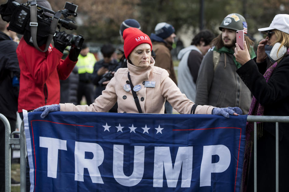 <p>A participant of an Alt-Right organized free speech event drapes a Trump campaign flag at the Boston Common on Nov. 18, 2017, in Boston, Mass. (Photo: Scott Eisen/Getty Images) </p>