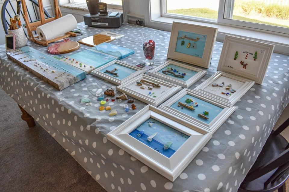 The art of Debbie Prue and Judy Porter are spread across a table on Prue’s Port Clinton home. Both women sell their art in local shops, and Prue teaches beach glass art classes at The Arts Garage.