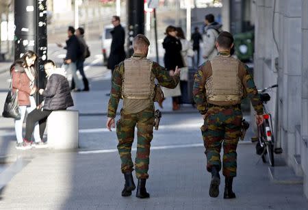 Belgian soldiers patrol in central Brussels, December 31, 2015. REUTERS/Francois Lenoir