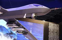 FILE - In this Feb. 25, 2018 file photo, a model of the Wing Loong II weaponized drone for the China National Aero-Technology Import & Export Corp. is displayed at a military drone conference in Abu Dhabi, United Arab Emirates. According to a report by the Royal United Services Institute, or RUSI released Monday, Dec. 17, 2018, the use of armed drones in the Middle East, driven largely by growing sales from China, has grown significantly in the past two years with an increasing number of state and non-state actors using them in regional conflicts. The report found that over the past few years, more and more countries across the Mideast have acquired armed drones, either by importing them or by building them domestically. (AP Photo/Jon Gambrell, File)