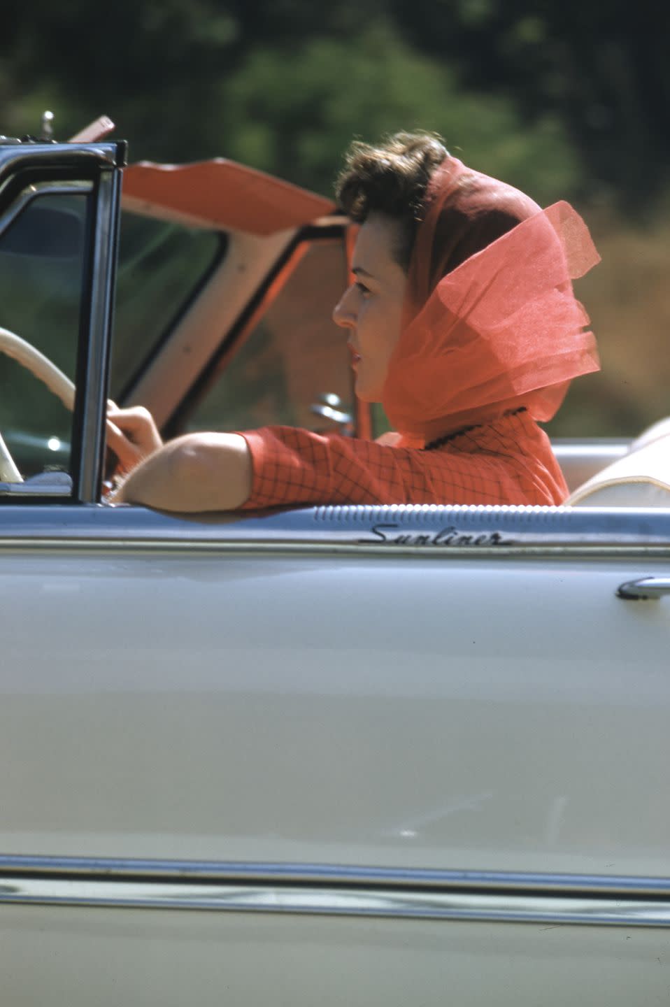 <p>Driving with the top down, sometime around 1954. </p>