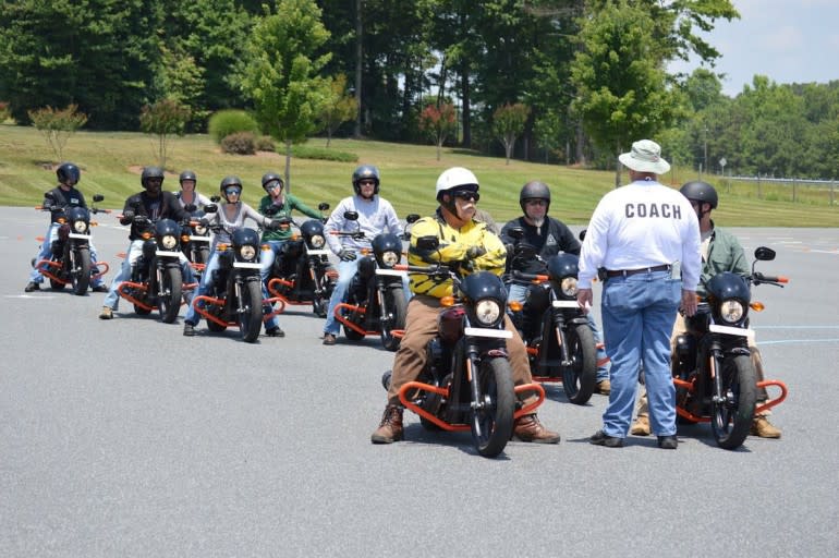 Harley-Davidson riding course with nine students and one instructor (who is not on a bike).