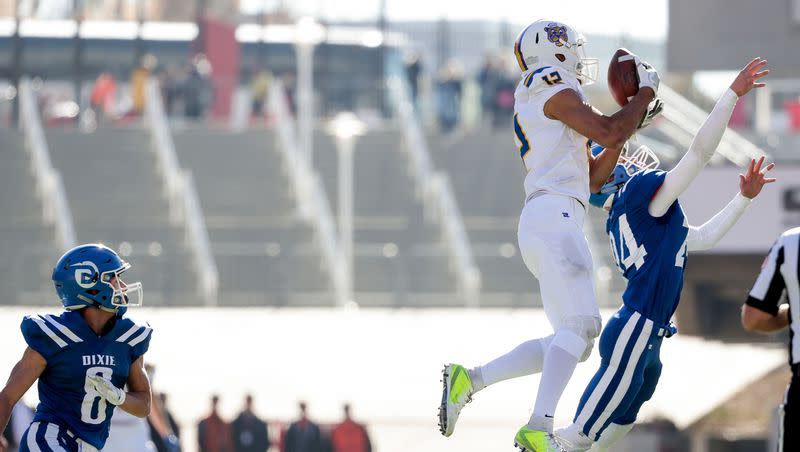 Orem’s Puka Nacua pulls in a long pass for a first down after multiple penalties set up a first-and-41 play in the 4A football state championship game against Dixie at Rice-Eccles Stadium in Salt Lake City on Friday, Nov. 16, 2018.