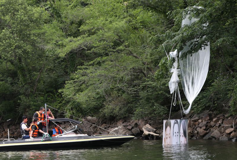 A balloon containing leaflets denouncing North Korean leader Kim Jong Un, released by a North Korean defector group on June 22, is seen found at a hill in Hongcheon