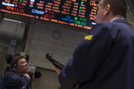 Traders work on the floor of the New York Stock Exchange February 4, 2014. REUTERS/Brendan McDermid