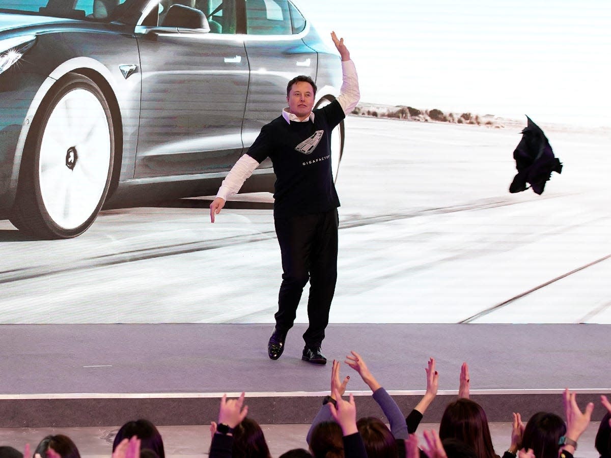 Elon Musk dances outside Tesla's Shanghai Gigafactory. Reuters