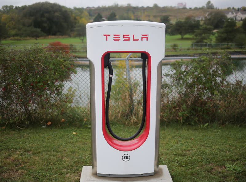 FILE PHOTO: A Tesla electric vehicle charger is seen at the edge of a parking lot in Kitchener