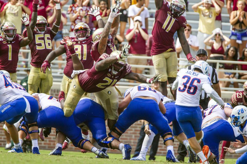 Florida State defense tries to block a field goal by Boise State place kicker Eric Sachse, right, in second the half of an NCAA college football game in Tallahassee, Fla., Saturday, Aug. 31, 2019. Boise State defeated Florida State 36-31. (AP Photo/Mark Wallheiser)