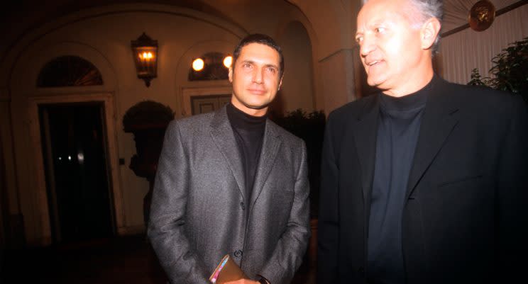 From the left, the fashion designer Antonio D'Amico and Santo Versace, respectively the former partner and the elder brother of the deceased Gianni Versace, are waiting the beginning of the fashion show dedicated to the spring/summer collection at the via Gesù seat. Milan (Italy), 6th March 1998. (Photo: Getty Images)