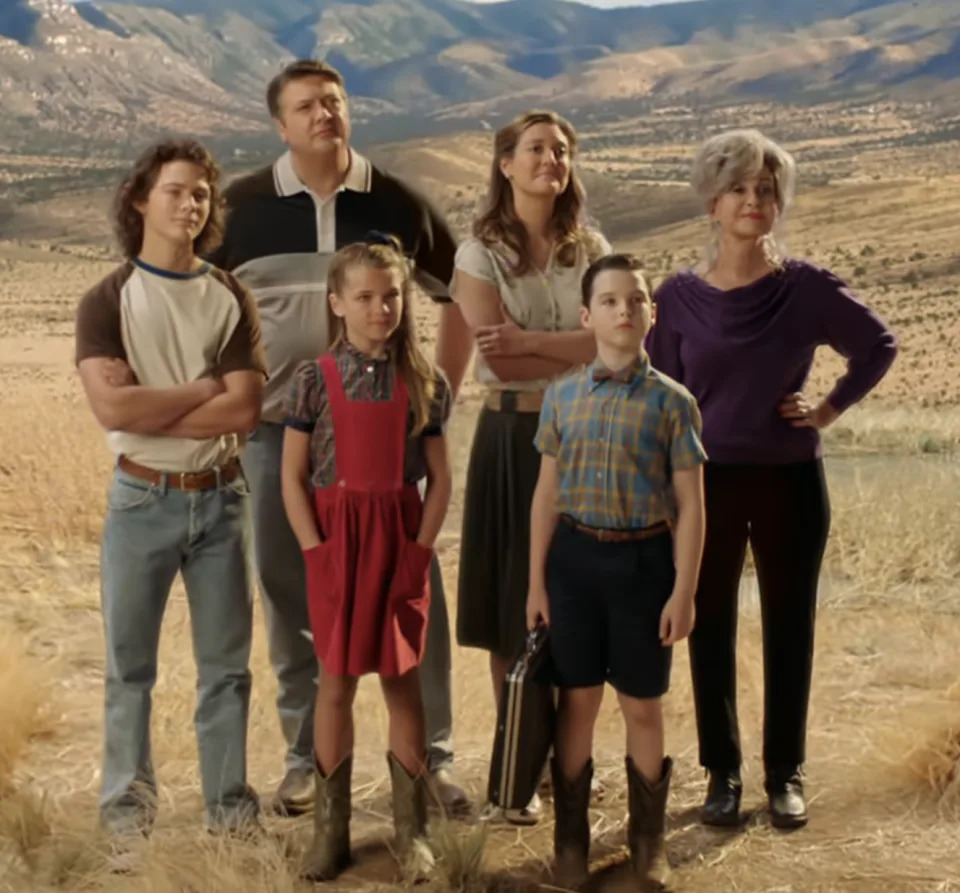 Georgie, George Sr, Missy, Mary, Sheldon, and Connie standing together in a field