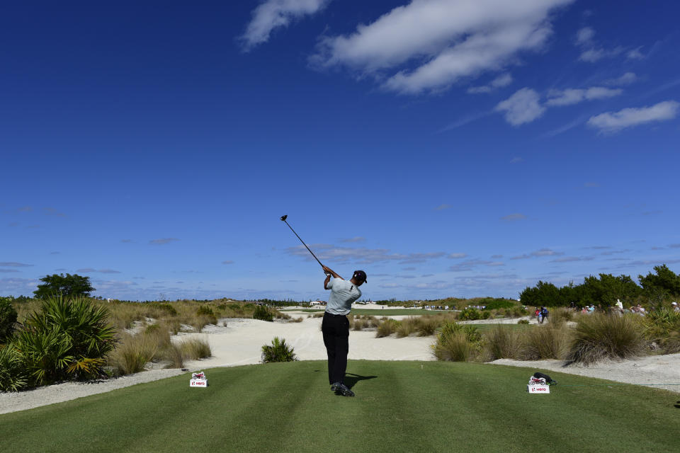 Tiger Woods hits from the third tee during the first round of the Hero World Challenge at the Albany Golf Club in Nassau, Bahamas, Thursday, Nov. 29, 2018. Woods now is No. 13 in the world as he hosts this holiday tournament for the 20th time. (AP Photo/Dante Carrer)