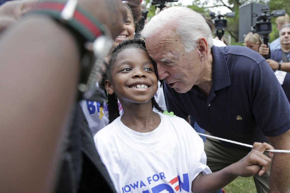 Democratic presidential candidate and former Vice President Joe Biden talks to a young supporter at the Polk County Democrats Steak Fry, in Des Moines, Iowa, Saturday, Sept. 21, 2019. (AP Photo/Nati Harnik)