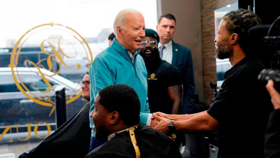 PHOTO: President Joe Biden greets staff and patrons at Regal Lounge, a Men's Barber and Spa, in Columbia, South Carolina, before speaking at the South Carolina's First in the Nation Dinner at the South Carolina State Fairgrounds on Jan. 27, 2024. (Kent Nishimura/AFP via Getty Images)