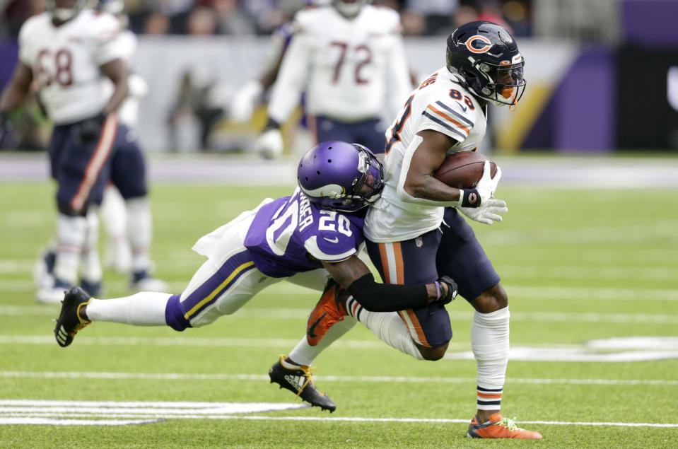 Chicago Bears wide receiver Javon Wims, right, tries to break a tackle by Minnesota Vikings cornerback Mackensie Alexander, left, after catching a pass during the first half of an NFL football game, Sunday, Dec. 29, 2019, in Minneapolis. (AP Photo/Andy Clayton-King)